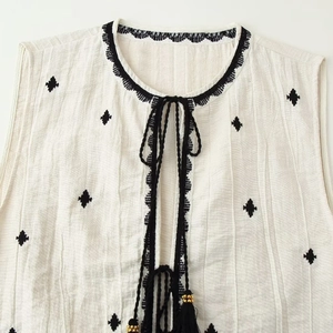 Women's white cotton linen vest set with ethnic embroidery and tassel tie details