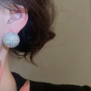 Sparkling cubic zirconia round stud earrings with silver needle in minimalist style