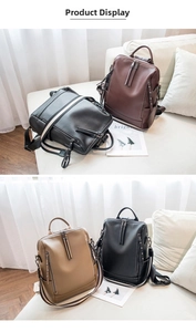 Detailed view of fashionable soft leather backpacks with metal rivets and dual zippers