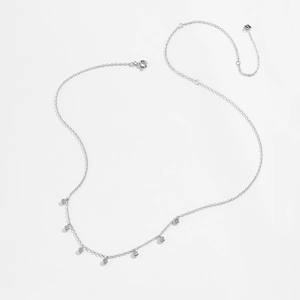 Detailed macro of S925 sterling silver chain featuring 7 round zircon charms and hallmark