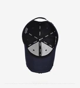 Detail shot of navy baseball cap interior with FBKS logo tape and neat stitching