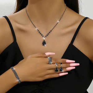 Elegant black crystal jewelry set with necklace, bracelet, earrings and elastic ring