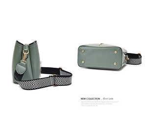 Detail view of green PU leather bucket bag featuring gold metal feet and zig-zag strap