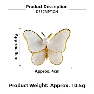 Macro shot of 4x3cm butterfly brooch with mother of pearl wings and white pearl center