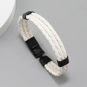 Detail of white multi-layer woven leather bracelet with black magnetic metal clasp