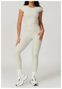 Detail view of off-white high-elastic yoga set with slim fit top and high waist leggings