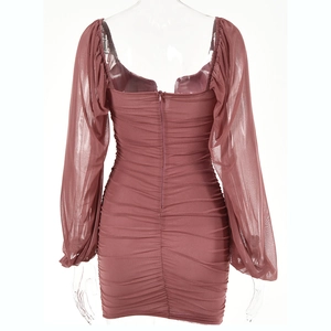 Detail view of back design with mesh lantern sleeves and ruching in dusty rose color