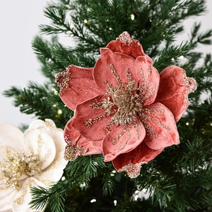 Velvet artificial magnolia flowers with glitter petals on green Christmas tree decor