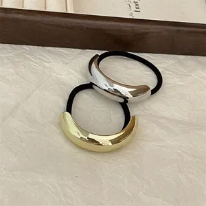Minimalist metallic alloy hair ties in gold and silver finish with sleek crescent shape