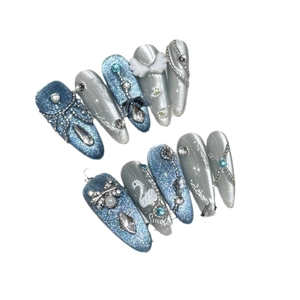Blue glitter swan nail set with silver wings, rhinestones and 3D bow decorations