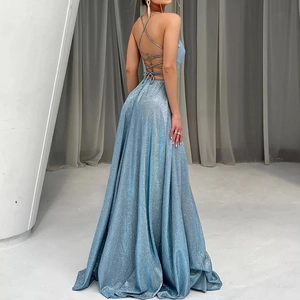 Elegant light blue backless sequin evening dress with cross straps and high slit detail