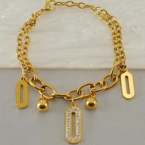 Gold stainless steel geometric bracelet with crystal-inlaid charms and polished spheres