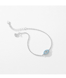 Detail of S925 silver evil eye bracelet with blue beads, pave diamonds and heart charm
