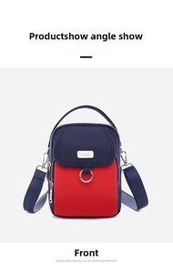 Front detail of contrast color nylon crossbody phone bag with metal hardware and strap