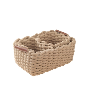 Square woven cotton rope storage basket with leather handles in cream beige