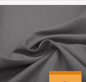 Close-up of the dark grey washed cotton fabric with soft texture and fine weave