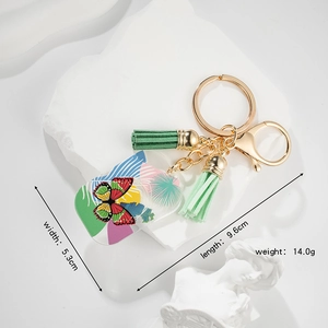 Hawaiian style butterfly acrylic keychain with green tassels and gold metal ring
