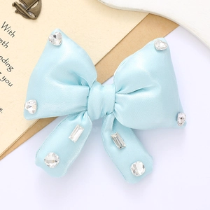 Sparkling light blue satin bow accessory with rhinestone details on white background