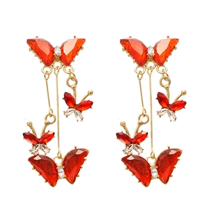 Elegant gold butterfly drop earrings with red crystals and long tassel fringe design