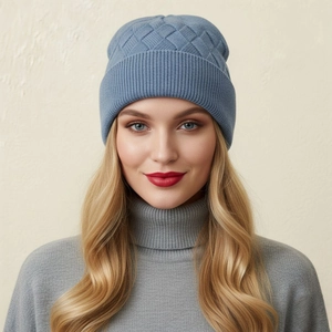 Close-up of blue diamond-knit beanie showing thick core-spun yarn texture and wide cuff
