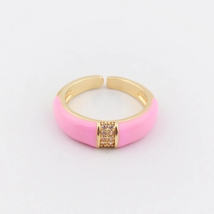 Detailed macro view of pink enamel adjustable gold-plated ring with shimmering zircons