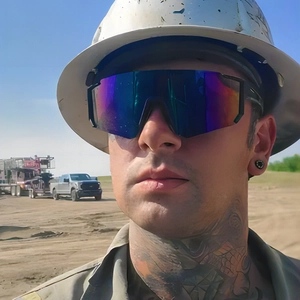Detailed view of large-frame polarized cycling sunglasses with gradient mirror lenses on model