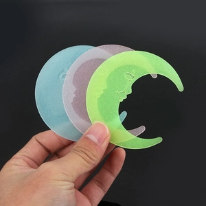 Luminous crescent moon wall stickers in blue, pink, and green for room decoration