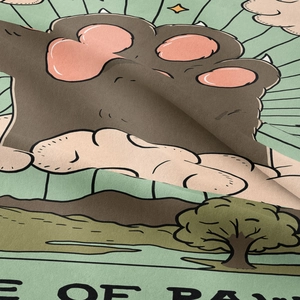 Close-up of bohemian tapestry fabric texture showing cartoon paw print illustration