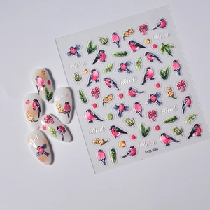 Macro detail of 5D embossed nail stickers featuring red bullfinches and green leaves