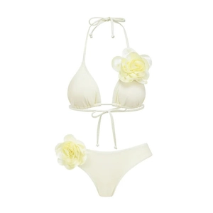 Two-piece cream white bikini set with 3D floral accents and halter neck tie design