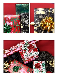 Macro view of Christmas gift wrapping paper featuring pink bows and green snowflakes