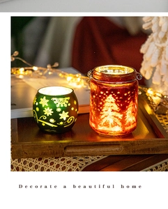 Cozy Christmas glass candle holders with warm light and festive snowflake patterns