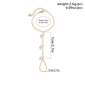 Detailed size and weight specs for gold ring-to-bracelet chain with white pearls