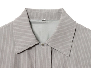 Detail of grey pinstripe bomber jacket collar with metal zipper and size M tag