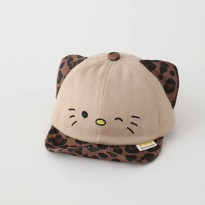Close-up of cute cat face embroidery and leopard print ears on toddler cotton cap