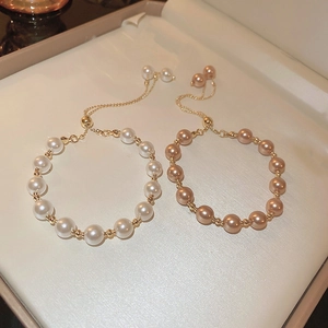 French vintage adjustable pearl bracelets in white and champagne with gold accents