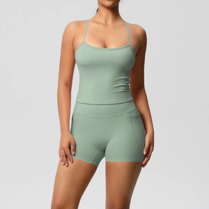 Detail of high-waist yoga shorts with side pocket in sage green moisture-wicking fabric