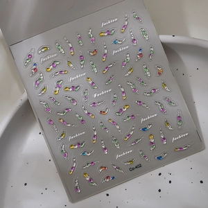 Vue détaillée des autocollants à ongles pailletés aux couleurs acidulées et strass variés