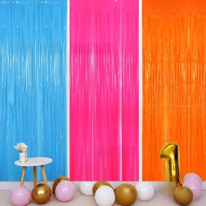 Close-up of pastel macaron fringe curtains in blue, pink, and orange for party backdrops