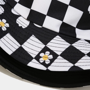 Detail of checkerboard pattern and daisy print on high-quality twill sun hat fabric