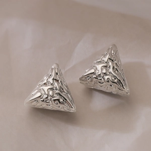 Minimalist silver triangle earrings with unique lava texture and geometric metal design