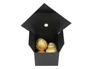Interior view of matte black graduation cap gift box with golden chocolate truffles