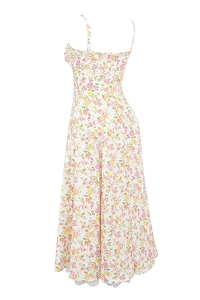 Detail of floral summer maxi dress featuring thin straps and white lace hemline trim