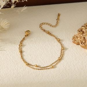 Double-layered 18k gold plated stainless steel bead bracelet with adjustable chain