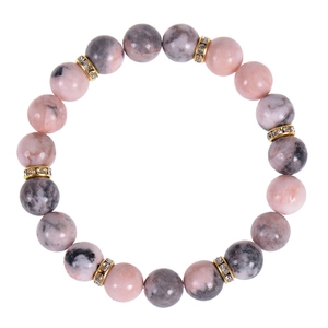 Macro detail of 8mm pink zebra stone beads and gold crystal spacers on elastic bracelet