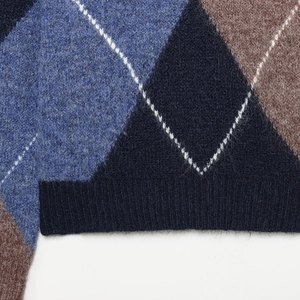 Classic argyle knit sweater with diamond pattern in navy and brown featuring ribbed hem