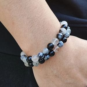 Elastic beaded bracelet featuring mixed natural black rutilated quartz round gemstones