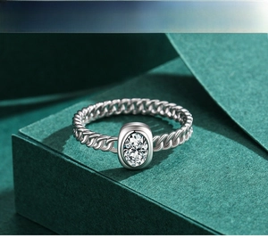 Macro view of s925 silver hollow chain ring with oval sparkling simulated diamond
