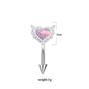 Silver heart-shaped eyebrow ring with pink opal and wing accents on white background
