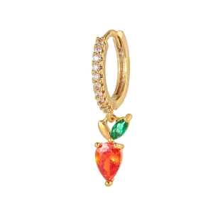 Detail of gold strawberry earrings with green leaves and inlaid red zircon gemstones
